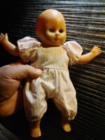 Bald blue-eyed blinking baby toy figure