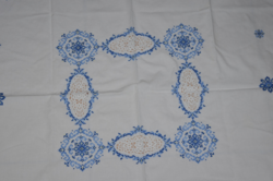 Table with cross-stitch embroidery in the middle