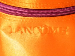 Lancome cosmetic orange cylindrical bag, toiletry bag