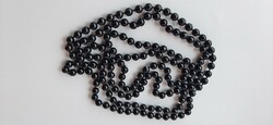 String of black glass beads knotted as vintage eyes, extra long