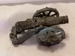 Any metal miniature cannon, shelf ornament, or decoration 25.
