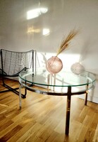 Mid-century round coffee table with metal frame, glass table