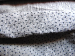 Dotted cotton scarf on a gray background
