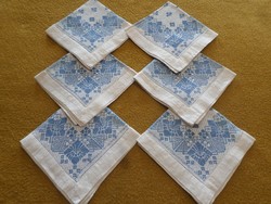 6 antique hand-embroidered monogrammed textile napkins with azure edges.