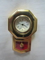 A collector's item in a display case--mini quartz clock