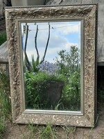 A wonderful frosted mirror in a silver worn wooden frame