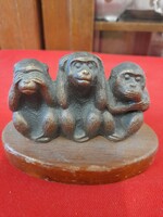 Bronze figure of three monkeys, statue on a wooden plinth.