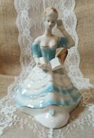 Lady reading a book. Arpo porcelain.