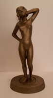 Bronzed metal nude sculpture