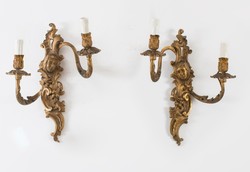 A pair of gilded bronze wall arms with a plastic female head
