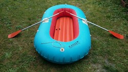 Old inflatable dinghy with paddle