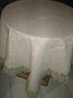 Beautiful and elegant dove gray woven tablecloth with a lace edge
