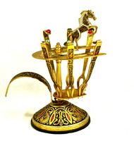 Small fork set with Spanish snacks on a equestrian figure stand