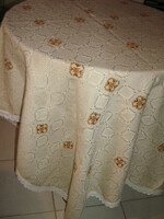 Beautiful, elegant, hand-embroidered ecru woven tablecloth with a lace edge