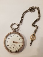 Antique silver pocket watch with key