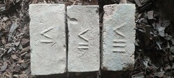 Stamped bricks are for sale.