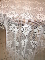 Beautiful snow-white filigree hand-crocheted antique floral lace tablecloth