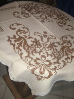 Beautiful, richly hand-embroidered cross-stitch woven tablecloth with a lace edge