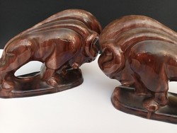 A pair of bookends with a hoppy artdeco bison pair