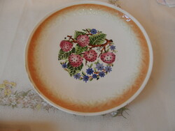 Older granite strawberry wall plate