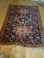 Antique oriental carpet with a blue - red - brown pattern