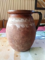 Old folk earthenware pot, jug with a handle