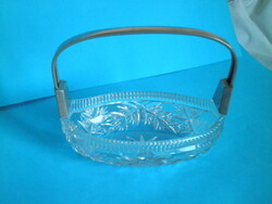 Thick glass oval centerpiece with metal handle, offering