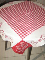 Beautiful red and white checkered tablecloth with a Bavarian motif