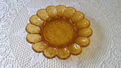 Beautiful amber-colored glass egg holder, offering