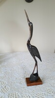 Retro, horned bird figure, on a wooden base