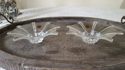 A pair of rcr crystal candle holders with a special shape