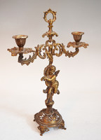 Copper candle holder with putto figure
