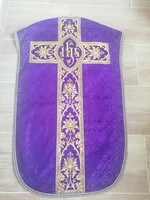 Purple, viola-colored brocade mass vestment with gold decoration. Priestly, liturgical, church clothing