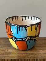 Retro ceramic flower pot with painted colorful fool abstract decoration