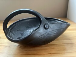 A special black irregular reed yard ceramic bowl with a handle