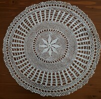 Round crochet tablecloth of medium size