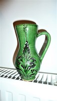 Marked green ceramic jug