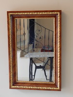 Biedermeier ökörszemes aranyozott és svartnis diófa borítású tükör. 100 x 65 cm.