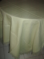 Elegant woven tablecloth with a beautiful apple green hand-crocheted edge