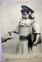Antique photo postcard of little girl giving