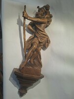 Saint Christopher is the patron saint of travelers. Hand carved wooden sculpture
