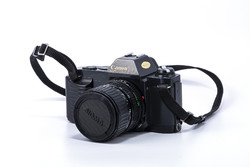 Canon fd t50 camera and sigma fd 35-70/3.5-4.5 macro lens pair.