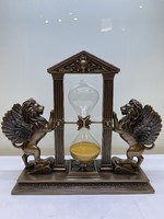 Bronzed lion hourglass sculpture