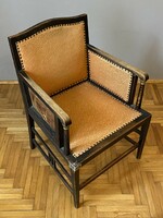 Antique Art Nouveau cane armchair with copper decoration