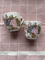 Pair of antique earthenware tea and coffee cups with a wild rose pattern