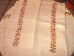 Beautiful antique hand-embroidered cross-stitch lace-edged woven tablecloth with decorative pillow