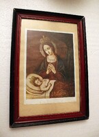 Old holy image in a wooden frame