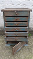 Double-sided vintage cabinet with many drawers