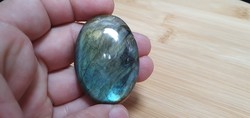 100 carat oval-shaped fiery labradorite.