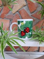 Ladybug mug decorated with flowers